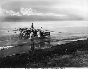 Trawl net fishing along the shore of Marina di Carrara