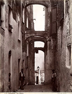 Bordighera Collection: View of the Via di Mezzo with people, in Bordighera
