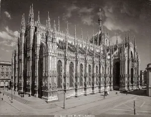 View of the facade and side of the Cathedral in Milan