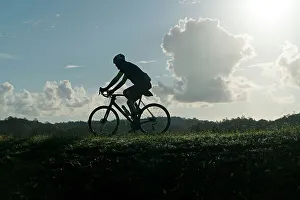 Silhouette of Man Riding Bicycle Print