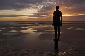 Prints of Another Place statues by artist Antony Gormley on Crosby beach, Merseyside, England, United Kingdom, Europe Merseyside Prints: Another Place Print: Antony Gormley's Crosby Beach Statues