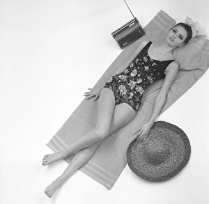 Retro Swimwear Fashion Prints: 1960s swimsuit fashion. A fashion model wearing the swimsuit fashion of 1963