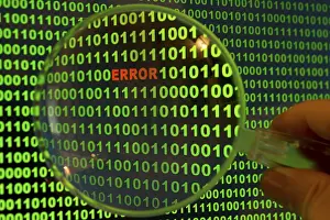 Computer Crime Scene Prints: Binary code with the word 'Error' viewed through a magnifying glass Binary code with the word
