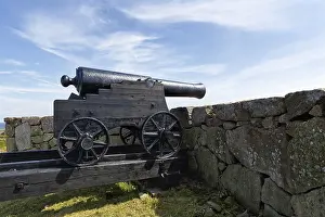 Prints of Cannon looking over stone wall at the sea, fortress, Kongens Bastion, Konigsbastion, Christianso, Christianso, Ertholmene, Pea Islands, Bornholm, Denmark Cannon looking over stone wall at the sea Castle Prints: Cannon Overlooking Sea, Kongens Bastion Print