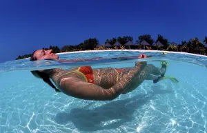 Woman In Swimsuit Prints: Swimmer in front of tropical Island Kuredu