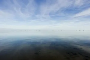 Overcast Sky Mirror Effect Prints: Cloud reflection in the mudflats