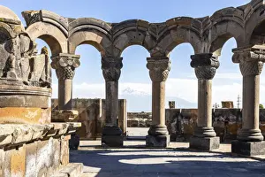 Prints of Colonnade in Zvartnots Cathedral and Ararat Mount on background in Armenia on sunny summer day. Zvartnots ruins are listed in UNESCO World Heritage Sites Armenia Prints: Print of Zvartnots Cathedral and Mount Ararat in Armenia
