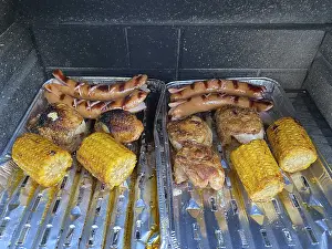 Prints of Corn on the corn cob, chicken fillet, red sausage, grilled food on aluminum shell, charcoal grill, grilling, food, Stuttgart, Baden-Wurttemberg, Germany Corn on the corn cob, chicken fillet Stuttgart Prints: Print of Grilled Food in Stuttgart, Germany