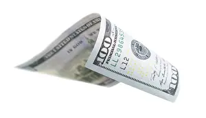 Currency Concept Image Prints: One hundred dollar bill falling or floating on empty background