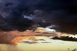 Dark Thunderclouds Prints: Dramatic cloud sky, dark thunderclouds at sunset