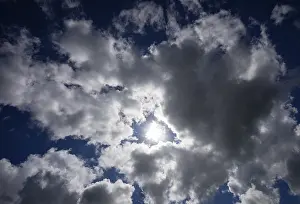Cloudy Atmosphere Prints: Dramatic cloudscape with (cumulus) clouds and sunrays