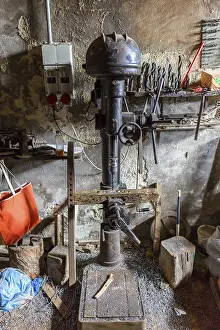 Traditional Craftsman Prints: Drilling machine in an old workshop
