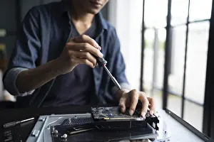 IT Engineer Prints: IT Engineer installing Hardware Equipment Development Facility Engineer Maintenance computer Motherboard Electronic