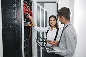 Computer Hacking Prints: IT expert checking supercomputer server