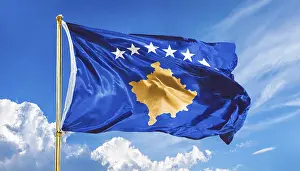 Prints of Flags, the national flag of Kosovo flutters in the wind Kosovo Prints: Kosovo National Flag Print