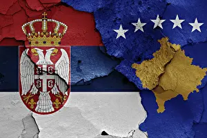 Prints of Flags of Serbia and Kosovo painted on cracked wall Kosovo Prints: Flags of Serbia and Kosovo Print on Cracked Wall
