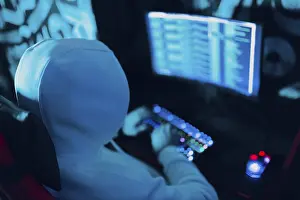 Computer Hacking Prints: Hacker using computer malware virus software and hacking binary code green digital interface