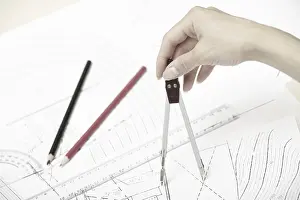 Engineering Blueprint Prints: Hand of engineer working on a construction plan