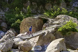 Prints of Hiker on bridge, Theth, National Park Theth, Albanian Alps, Prokletije, Qark Shkodra, Albania Albania Prints: Theth Hiker Print, Albanian Alps Landscape