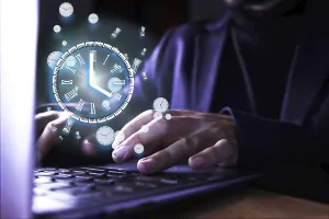 Remote Work Prints: Image of a man using the computer with a clock indicating the time of use of the pc