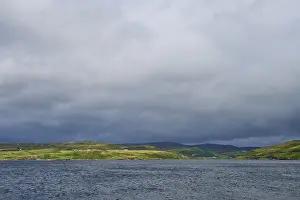 United Kingdom Travel Photography Prints: Lake with dramatic clouds and green rolling hills in the background