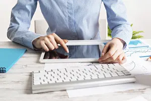 Business Accounting Prints: Manager using tablet computer with blank screen