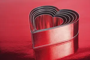 Romantic Image Prints: Some of the metal hearts shaped over red background