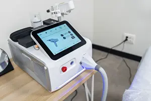 Cosmetic Procedures Prints: Modern laser machine with a touchscreen interface showcasing its functions