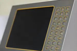 Automated Manufacturing Process Prints: Monitor with touch-sensitive buttons on machine