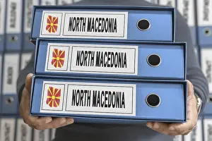 Prints of North Macedonia Administrative Files, Hands Holding Folders Macedonia Prints: North Macedonia Administrative Files Print
