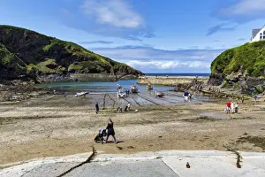 Port Isaac Prints: Pedestrians in Harbour at Low Tide Print, Cornwall, England