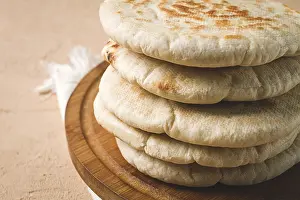 Uninhabited Dining Area Prints: Pita bread, stack, on the table, no people