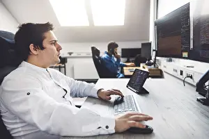 Modern Technology Prints: IT Programmer Working on Desktop Computer