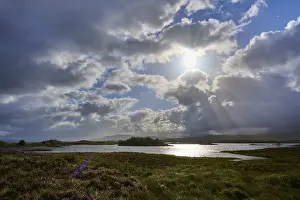 Rannoch Moor Landscape Prints: Reflecting lake under a sky with dramatic clouds and sun rays