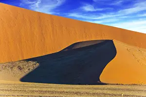 Namibia Landscape Prints: Sharp border of light and shadow over the crest of the dune