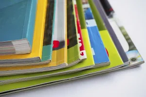 Magazine Stack Prints: Stack of magazines on white background