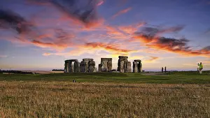 Prints of Stonehenge, Neolithic stone circle with visitors at sunset, Salisbury Plain, Wiltshire, England, United Kingdom Salisbury Prints: Stonehenge Print at Sunset, Wiltshire, England