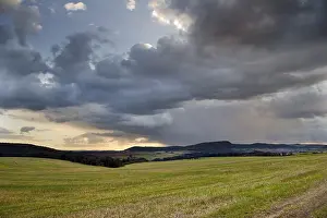 Stormy Atmosphere Prints: Storm clouds over fields