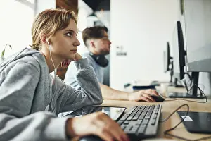 Education System Prints: Students learning in computer classroom