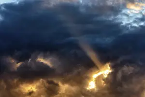Dramatic Evening Sky Prints: Sunbeam through gap in clouds, dramatic evening sky