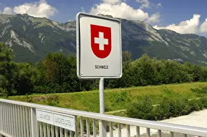 Prints of Swiss border sign on the Rhine river bridge, national border Switzerland, Principality of Liechtenstein Liechtenstein Prints: Swiss Border Sign on Rhine River Bridge Print