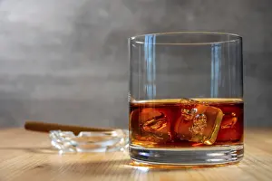 United Kingdom Travel Photography Prints: On the table is a glass of whiskey with ice cubes