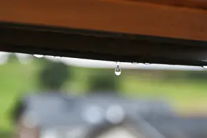 German Weather Prints: Tiny raindrop hangs on window frame