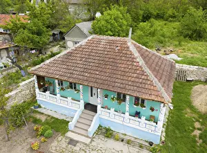 Prints of Traditional house with wooden tiles and colorful walls in a rural area with lots of greenery, aerial view, Butuceni, Old Orhei, Orheiul Vechi, archaeological site, historical-landscape reserve Moldova Prints: Traditional House Print, Butuceni, Republic of Moldova