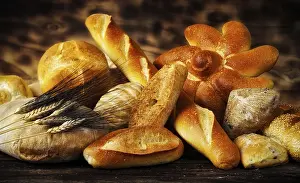 Rustic Bread Prints: Various types of bread in a rustic setting with warm light