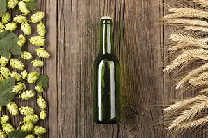 Prints of Top view beer bottle with ingredients. Resolution and high quality beautiful photo Munich (Munchen) Prints: High-Quality Top View Beer Bottle Print with Ingredients