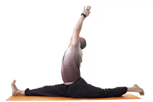 Yoga Trainer Prints: Side view of yoga trainer posing on split