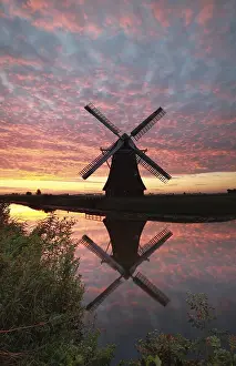 Prints of Windmill and dramatic sunrise sky reflected in river, Holland River Prints: Windmill and Sunrise Sky Reflected in River Print, Holland