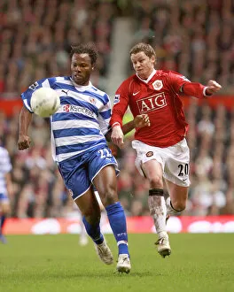 Images Dated 18th February 2007: Andre Bikey holds off Ole Gunnar Solskjaer at Old Trafford