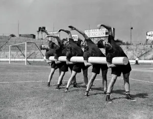 Chelsea Team Training Print - Players Stretching with 125lbs Log